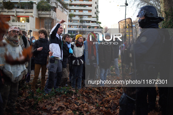 Protesters face riot police near the Administrative Court of Toulouse. Between 1,000 and 1,500 people gather in Toulouse, France, on Decembe...