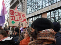 A woman holds a placard reading 'Stop to unlawful project' in front of the Administrative Court of Toulouse. Between 1,000 and 1,500 people...