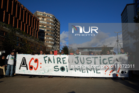 The banner reads 'A69: justice must be done by ourselves?' Between 1,000 and 1,500 people gather in Toulouse, France, on December 15, 2024,...