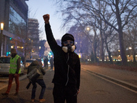 A protester raises his fist after riot police use tear gas. Between 1,000 and 1,500 people gather in Toulouse, France, on December 15, 2024,...