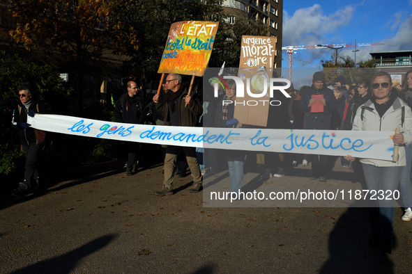 The banner reads 'People demand justice'. Between 1,000 and 1,500 people gather in Toulouse, France, on December 15, 2024, against a non-adm...