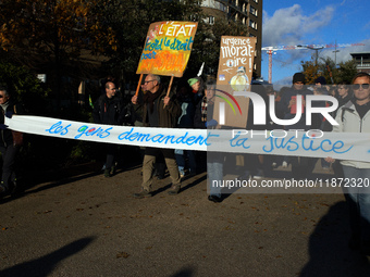 The banner reads 'People demand justice'. Between 1,000 and 1,500 people gather in Toulouse, France, on December 15, 2024, against a non-adm...