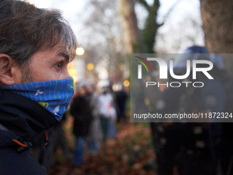 An angry protester looks at riot policemen near the Administrative Court of Toulouse. Between 1,000 and 1,500 people gather in Toulouse, Fra...