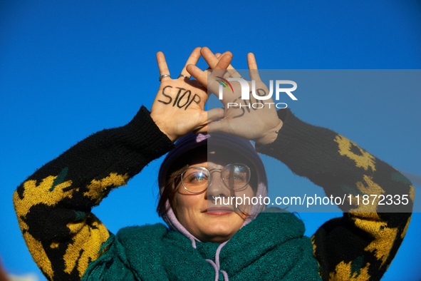 A protester writes 'No' on her hands. Between 1,000 and 1,500 people gather in Toulouse, France, on December 15, 2024, against a non-adminis...