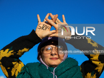 A protester writes 'No' on her hands. Between 1,000 and 1,500 people gather in Toulouse, France, on December 15, 2024, against a non-adminis...