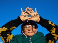 A protester writes 'No' on her hands. Between 1,000 and 1,500 people gather in Toulouse, France, on December 15, 2024, against a non-adminis...