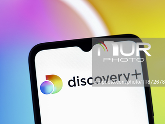 The Discovery Plus logo appears on the screen of a smartphone in Reno, United States, on December 15, 2024. (