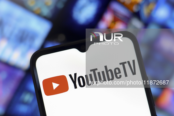 The YouTube TV logo appears on the screen of a smartphone and in the background on the computer screen in Reno, United States, on December 1...