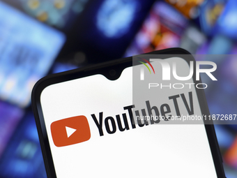 The YouTube TV logo appears on the screen of a smartphone and in the background on the computer screen in Reno, United States, on December 1...