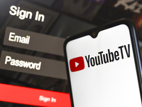 The YouTube TV logo appears on a smartphone screen next to a login screen with email and password in Reno, United States, on December 15, 20...