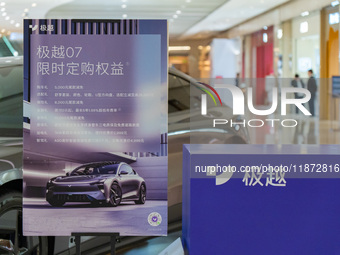 Pedestrians pass an empty Jidu auto shop in Chongqing, China, on December 14, 2024. (