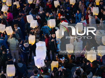 Citizens release Kongming lanterns after a New Year Lantern Festival in Chongqing, China, on December 14, 2024. (