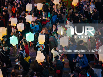 Citizens release Kongming lanterns after a New Year Lantern Festival in Chongqing, China, on December 14, 2024. (