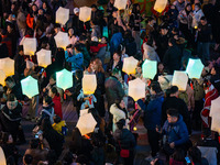 Citizens release Kongming lanterns after a New Year Lantern Festival in Chongqing, China, on December 14, 2024. (