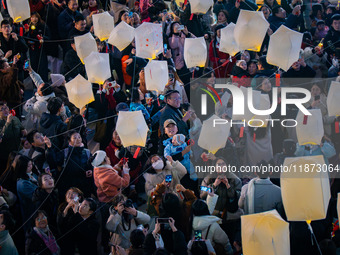 Citizens release Kongming lanterns after a New Year Lantern Festival in Chongqing, China, on December 14, 2024. (