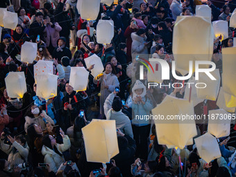 Citizens release Kongming lanterns after a New Year Lantern Festival in Chongqing, China, on December 14, 2024. (