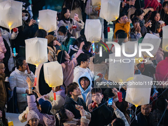 Citizens release Kongming lanterns after a New Year Lantern Festival in Chongqing, China, on December 14, 2024. (