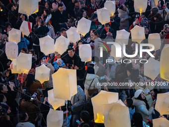 Citizens release Kongming lanterns after a New Year Lantern Festival in Chongqing, China, on December 14, 2024. (