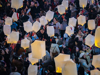 Citizens release Kongming lanterns after a New Year Lantern Festival in Chongqing, China, on December 14, 2024. (