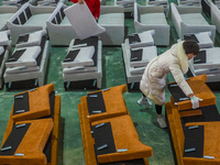 A worker produces sofas for sale to Europe and the United States in a furniture workshop in Suqian, Jiangsu province, China, on December 15,...