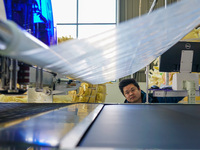 A worker produces sofas for sale to Europe and the United States in a furniture workshop in Suqian, Jiangsu province, China, on December 15,...