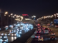 Vehicles travel along the West Fourth Ring Road at night in Beijing, China, on December 15, 2024. (