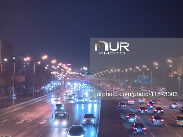 Vehicles travel along the West Fourth Ring Road at night in Beijing, China, on December 15, 2024. 