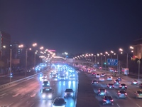 Vehicles travel along the West Fourth Ring Road at night in Beijing, China, on December 15, 2024. (