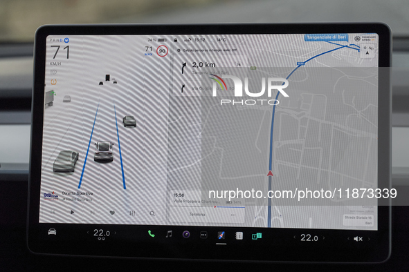 The images show the Tesla Model Y equipped with its Level 2 autonomous driving capabilities. The photos highlight the vehicle's logo, the na...