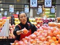 A consumer shops at a supermarket in Handan, China, on December 9, 2024. On December 16, 2024, the National Bureau of Statistics releases da...