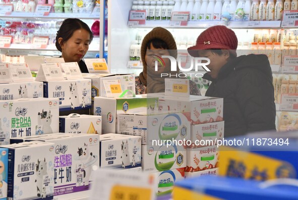 A consumer shops at a supermarket in Handan, China, on December 9, 2024. On December 16, 2024, the National Bureau of Statistics releases da...