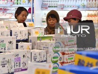 A consumer shops at a supermarket in Handan, China, on December 9, 2024. On December 16, 2024, the National Bureau of Statistics releases da...