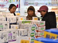 A consumer shops at a supermarket in Handan, China, on December 9, 2024. On December 16, 2024, the National Bureau of Statistics releases da...