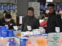 A consumer shops at a supermarket in Handan, China, on December 9, 2024. On December 16, 2024, the National Bureau of Statistics releases da...