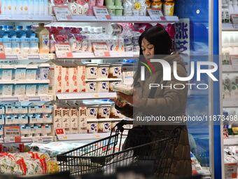 A consumer shops at a supermarket in Handan, China, on December 9, 2024. On December 16, 2024, the National Bureau of Statistics releases da...