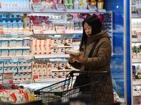 A consumer shops at a supermarket in Handan, China, on December 9, 2024. On December 16, 2024, the National Bureau of Statistics releases da...