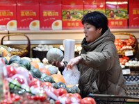 A consumer shops at a supermarket in Handan, China, on December 9, 2024. On December 16, 2024, the National Bureau of Statistics releases da...