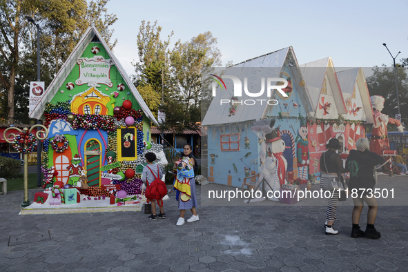 Dozens of people visit a Christmas village set up in the Tlahuac Forest in Mexico City, Mexico, on December 15, 2024. 