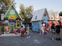 Dozens of people visit a Christmas village set up in the Tlahuac Forest in Mexico City, Mexico, on December 15, 2024. (