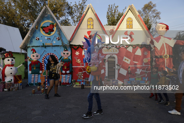 Dozens of people visit a Christmas village set up in the Tlahuac Forest in Mexico City, Mexico, on December 15, 2024. 