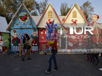 Dozens of people visit a Christmas village set up in the Tlahuac Forest in Mexico City, Mexico, on December 15, 2024. (