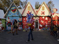 Dozens of people visit a Christmas village set up in the Tlahuac Forest in Mexico City, Mexico, on December 15, 2024. (