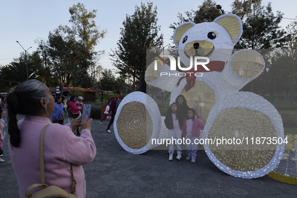 Dozens of people visit a Christmas village set up in the Tlahuac Forest in Mexico City, Mexico, on December 15, 2024. 