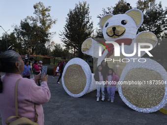 Dozens of people visit a Christmas village set up in the Tlahuac Forest in Mexico City, Mexico, on December 15, 2024. (