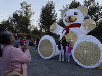 Dozens of people visit a Christmas village set up in the Tlahuac Forest in Mexico City, Mexico, on December 15, 2024. (