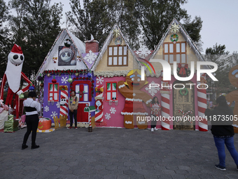 Dozens of people visit a Christmas village set up in the Tlahuac Forest in Mexico City, Mexico, on December 15, 2024. (