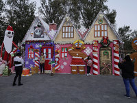 Dozens of people visit a Christmas village set up in the Tlahuac Forest in Mexico City, Mexico, on December 15, 2024. (