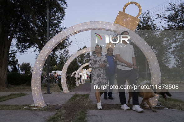 Dozens of people visit a Christmas village set up in the Tlahuac Forest in Mexico City, Mexico, on December 15, 2024. 