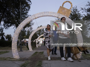 Dozens of people visit a Christmas village set up in the Tlahuac Forest in Mexico City, Mexico, on December 15, 2024. (