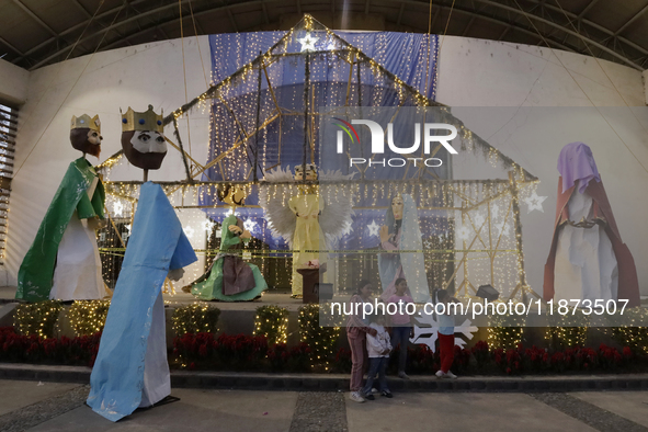 Dozens of people visit a Christmas village set up in the Tlahuac Forest in Mexico City, Mexico, on December 15, 2024. 